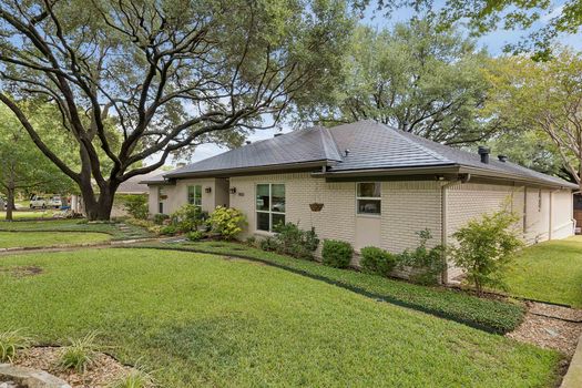 Front exterior with landscaped beds | 9020 Glen Springs Dr, Dallas, TX 75243 | Lake Highlands
