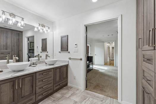 Primary bath with double vessel-sink vanity | 9020 Glen Springs Dr, Dallas, TX 75243 | Lake Highlands