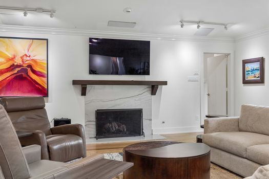 Living room with remodeled fireplace and mantel | 9020 Glen Springs Dr, Dallas, TX 75243 | Lake Highlands