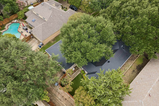 Aerial view of metal roof and backyard | 9020 Glen Springs Dr, Dallas, TX 75243 | Lake Highlands