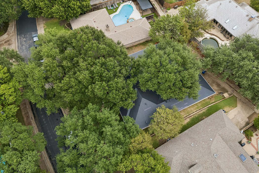 Aerial view of home among mature trees | 9020 Glen Springs Dr, Dallas, TX 75243 | Lake Highlands