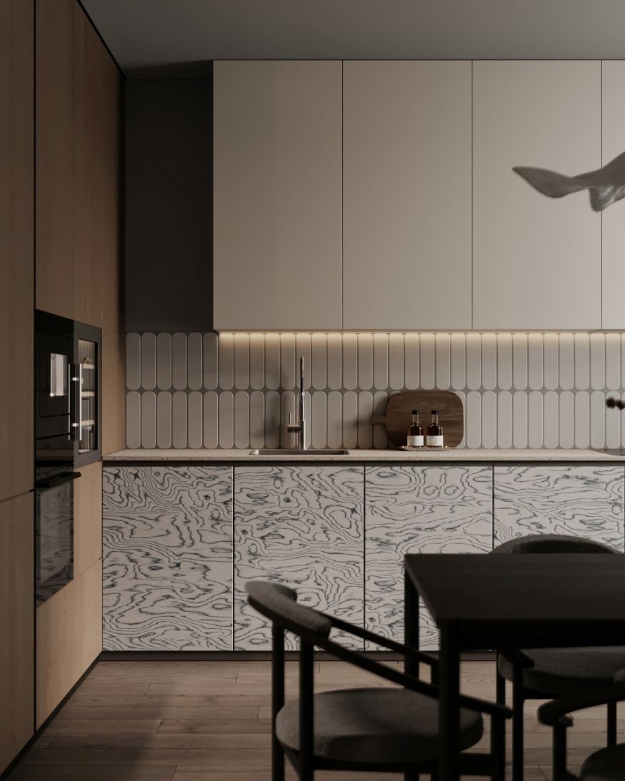 Contemporary kitchen interior with patterned cabinet fronts, integrated lighting and modern dining area.