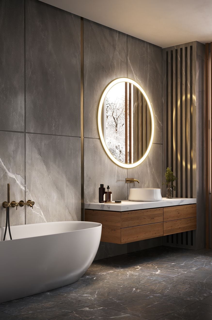 Luxurious modern bathroom interior with a sleek freestanding white bathtub and golden fixtures, set against elegant gray marble walls