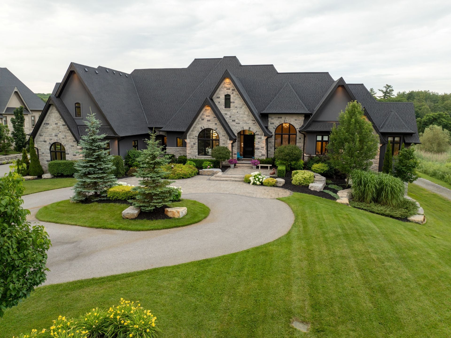 Stunning aerial views of a luxury million-dollar house, showcasing an expansive backyard with a pristine swimming pool, elegant exterior l)
