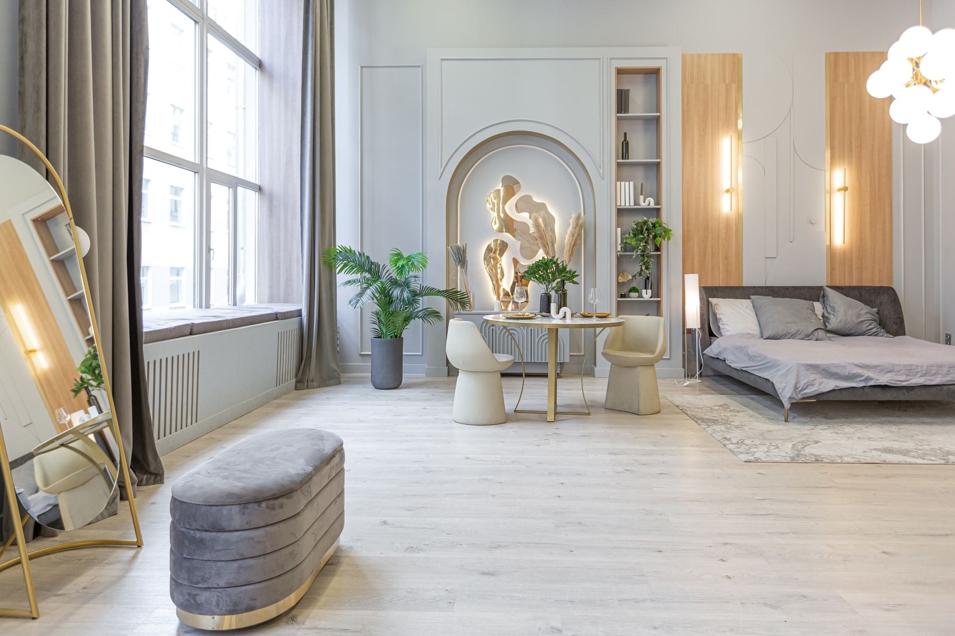 stylish luxury interior of modern studio apartment in green pastel colors with wooden elements. expensive furniture and decorations (1)