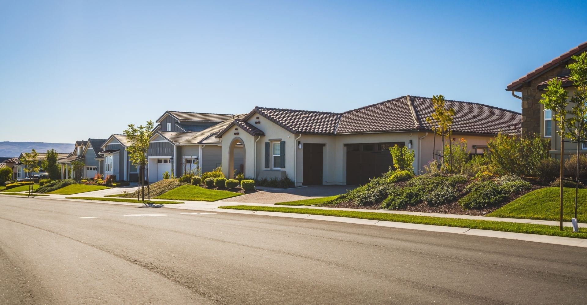 Luxury homes on an empty street in small town somewhere in California