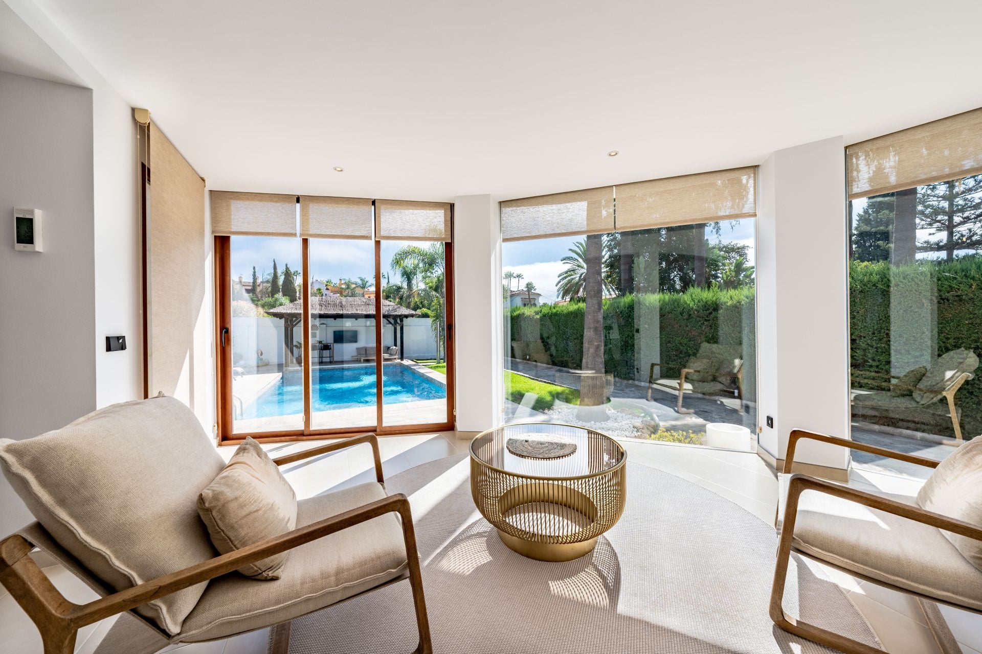 an image of a luxury viewing gallery in luxury villa with views overlooking the private swimming pool in the garden