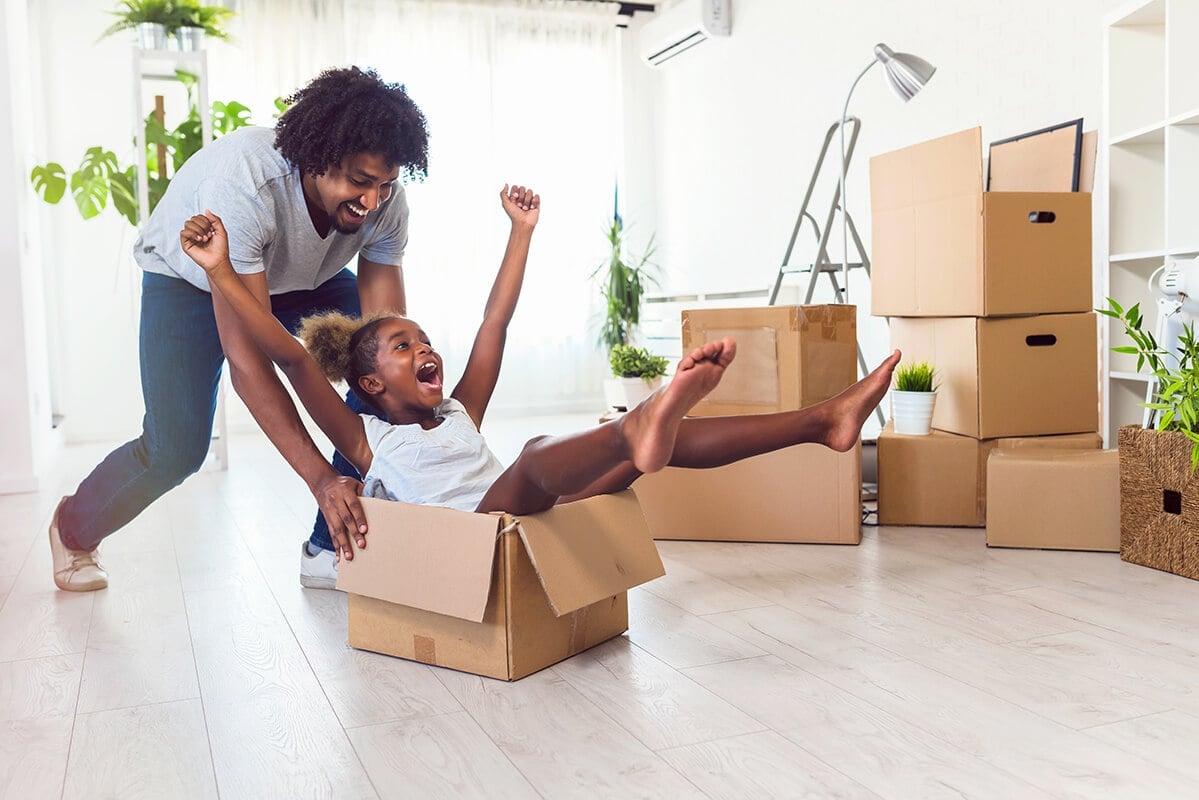 Father-push-daughter-in-carton-box