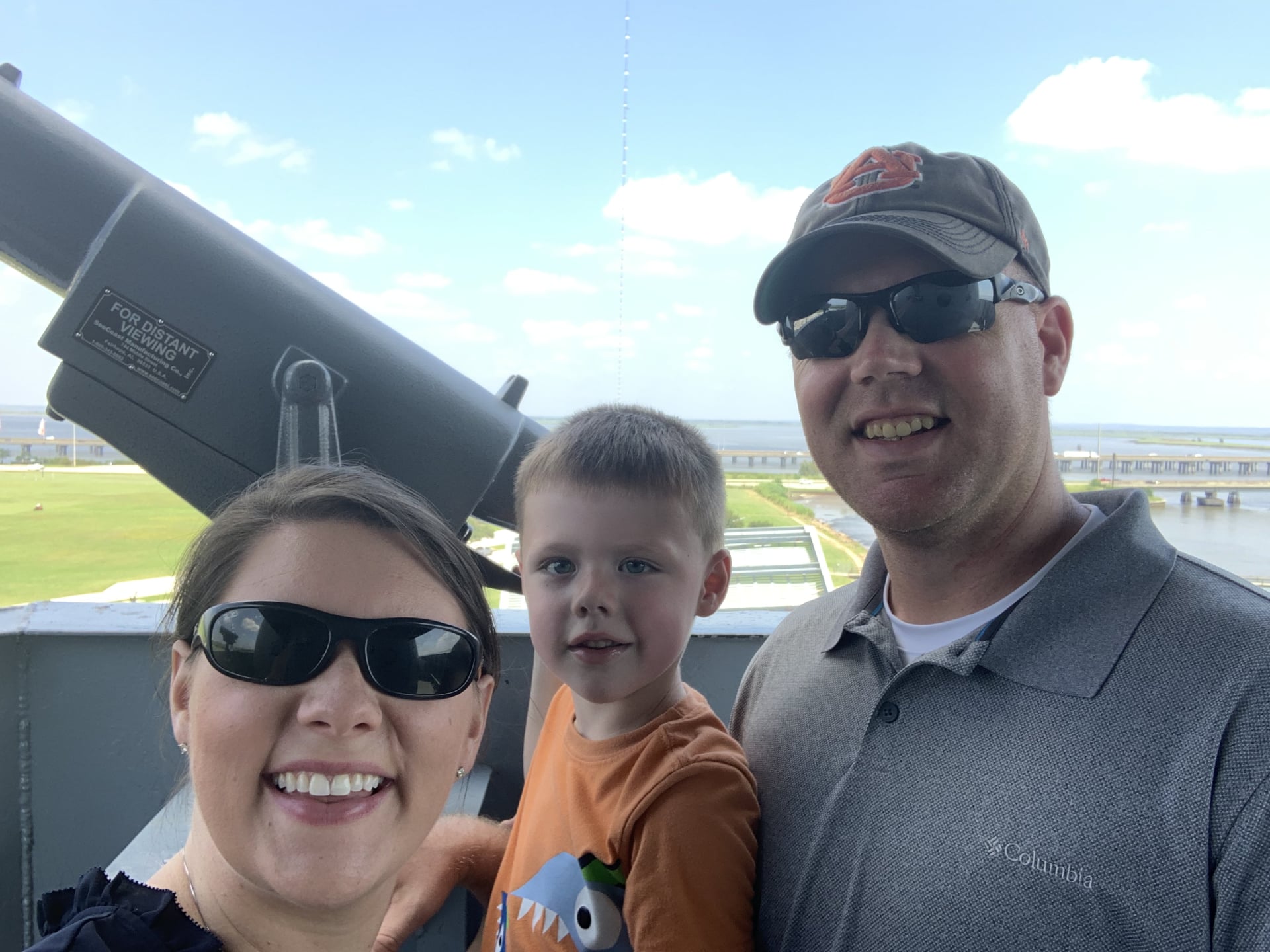 Kelli Salter and her husband Mike with family on the deck of a battleship