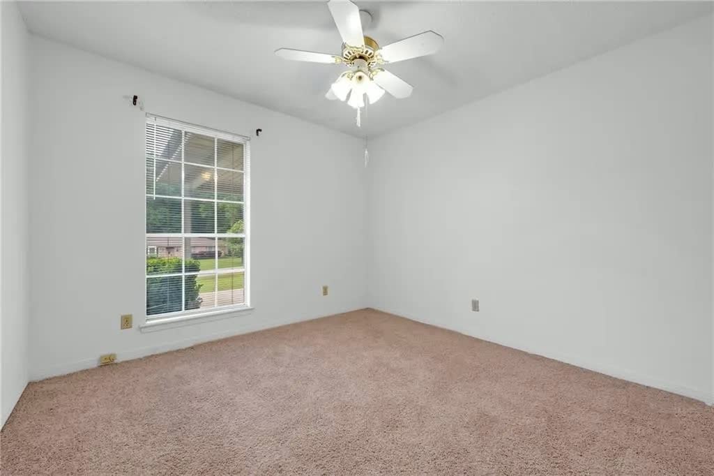 Bedroom with exterior window at 4436 Laurel Drive in Saraland, Alabama