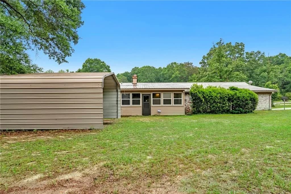 Rear exterior and yard at 4436 Laurel Drive in Saraland, Alabama