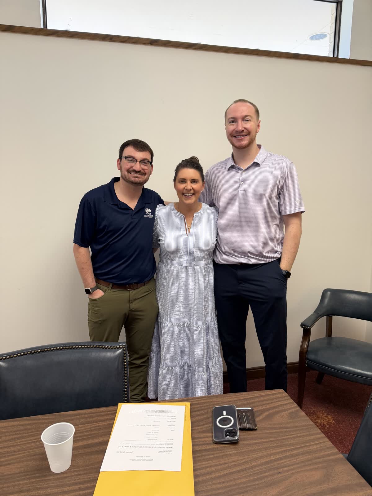Jacob and Zac with Kelli Salter at the closing table