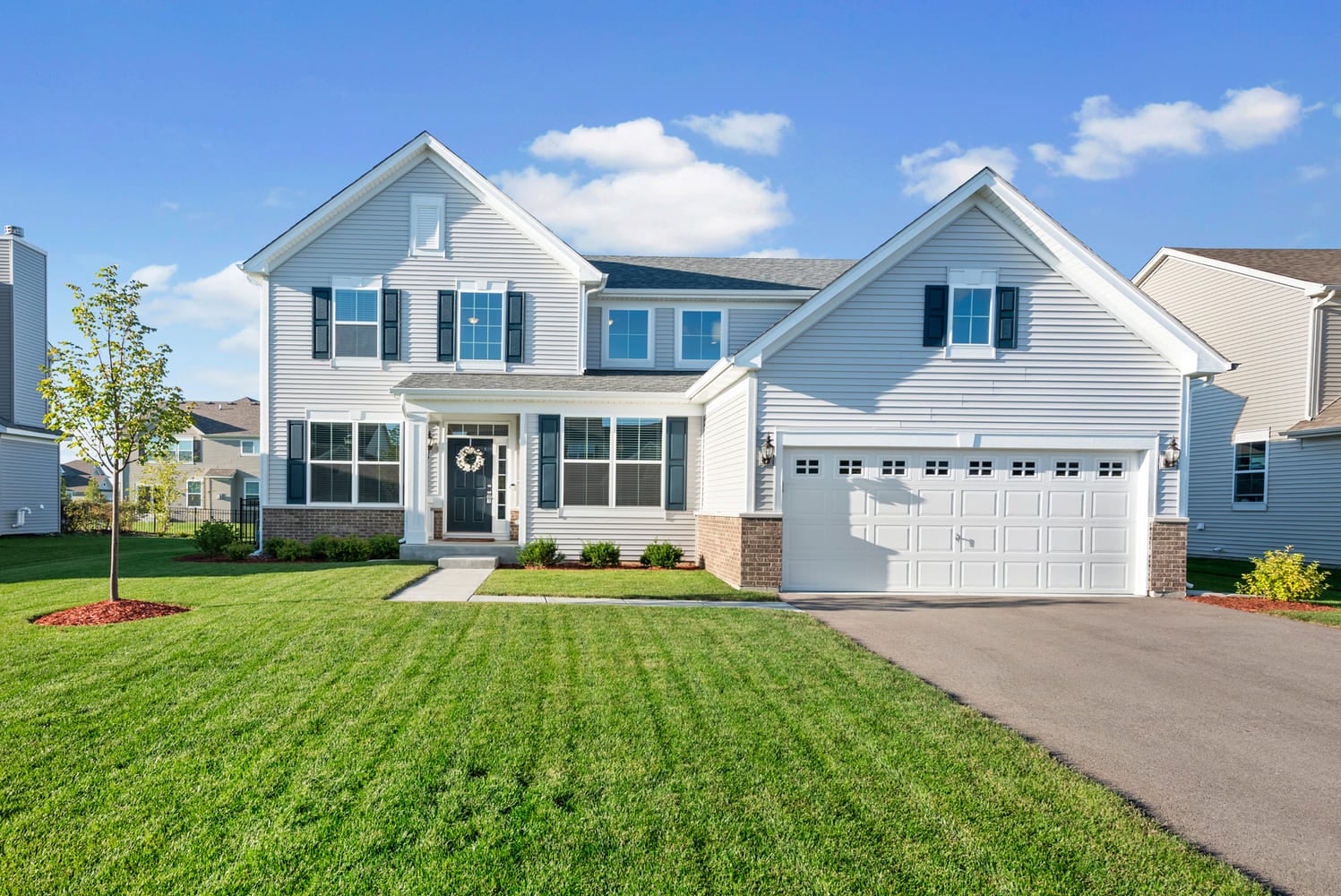light-gray-two-story-home-with-two-car-garage