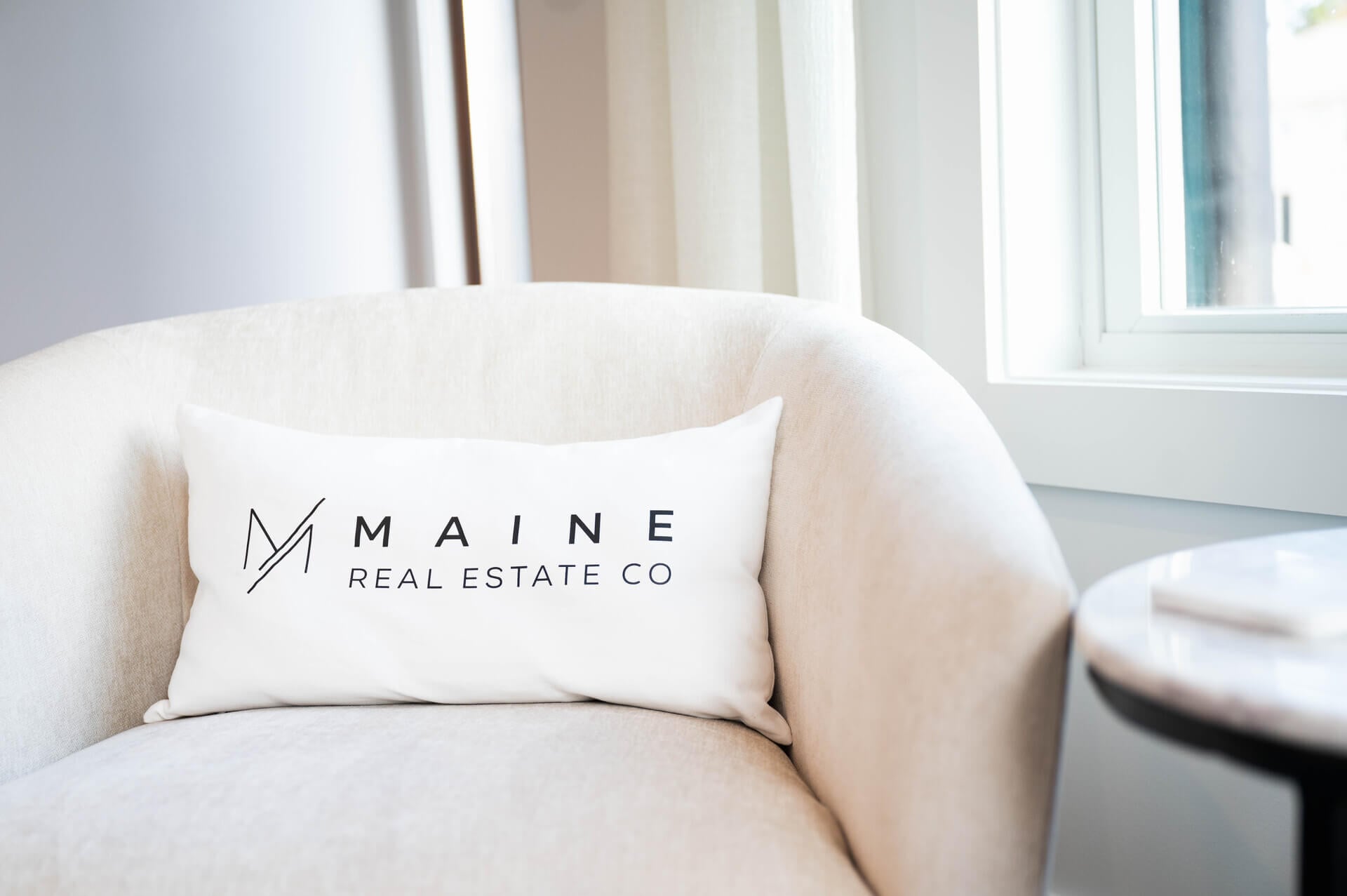 Close-up of Branded Pillow in Modern Chair