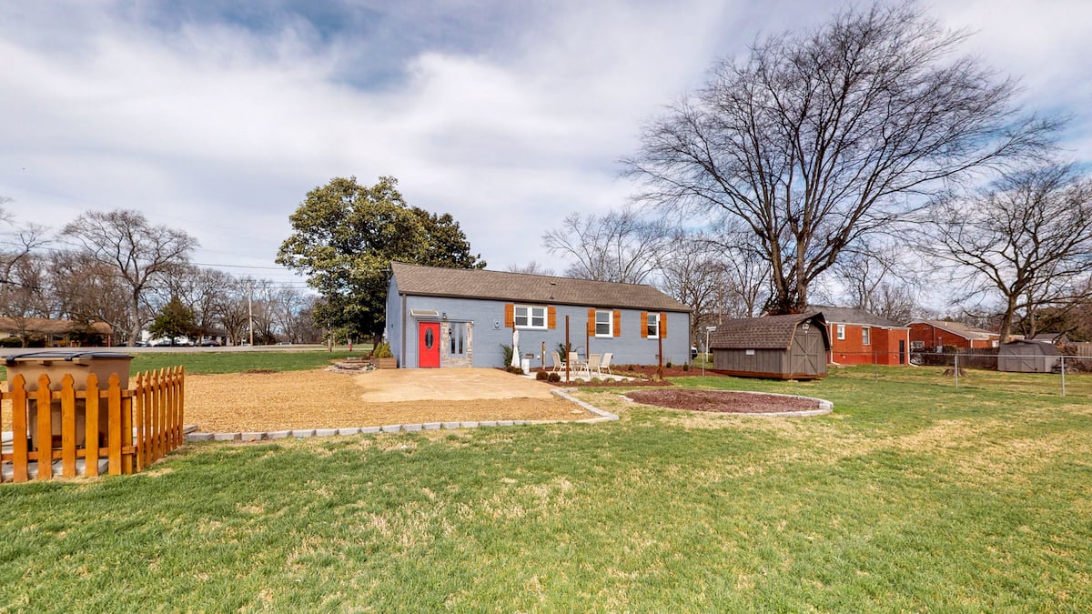 back yard with trash can - 2509 David Drive, Donelson home for sale