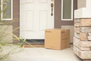 cardboard box package delivery on porch
