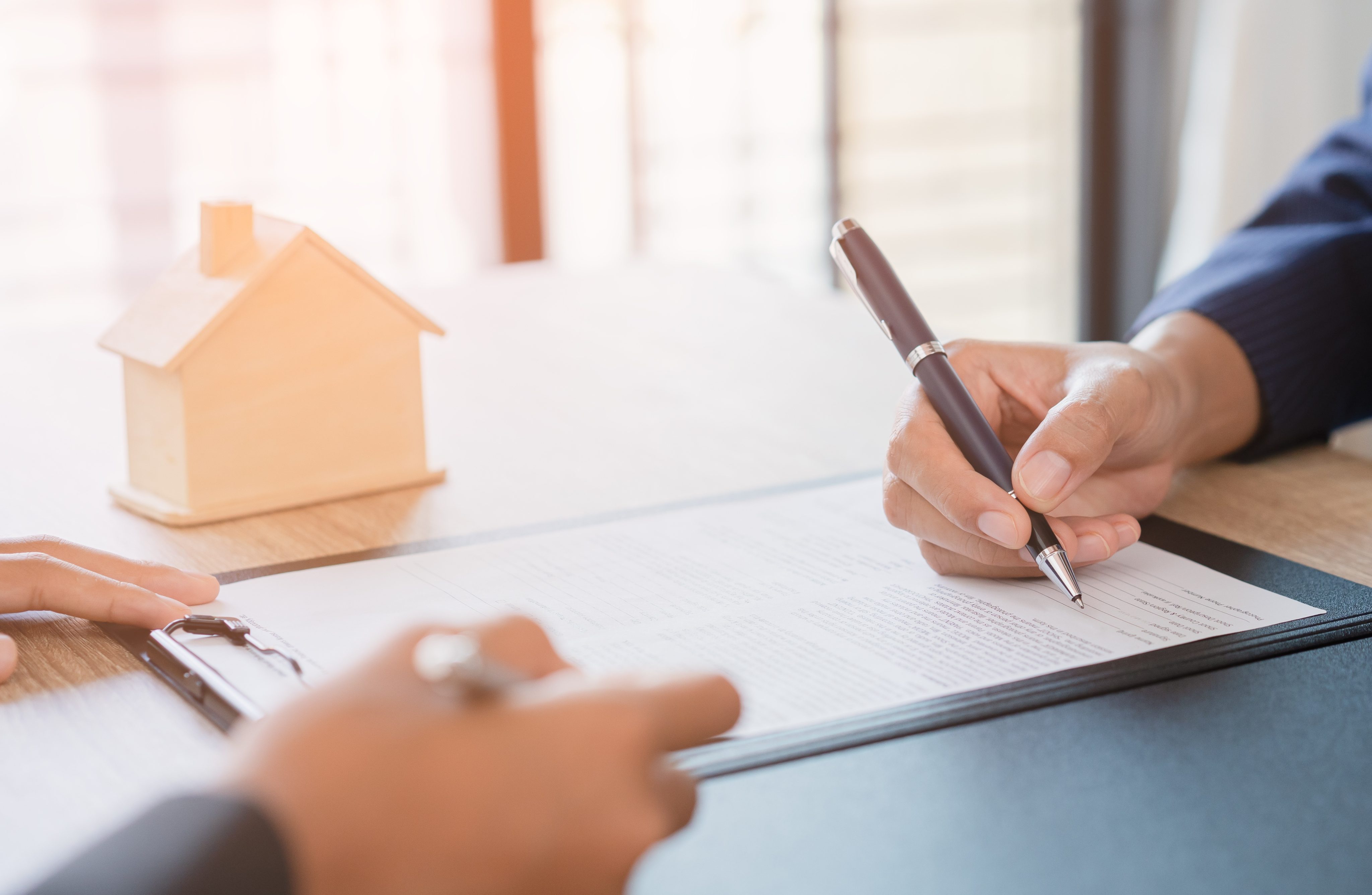 Salesmen are letting the woman customers sign the sales contract, Asian women and female are doing business in the office, Business concept and contract signing